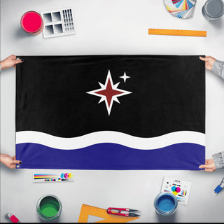 A mockup of the custom flag 'Grand Union of Grand Manan flag' held up on a table during print checking