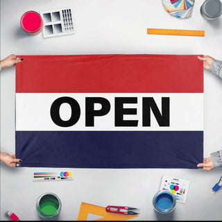 A mockup of the custom flag 'Open Flag' held up on a table during print checking