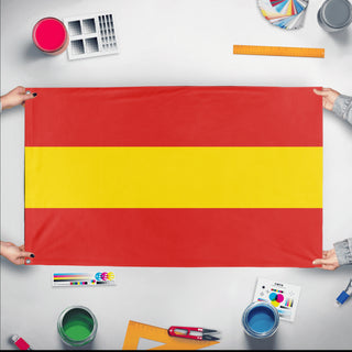 A mockup of the custom flag 'Red and Yellow Striped Flag' held up on a table during print checking