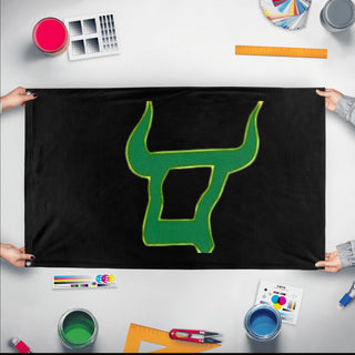 A mockup of the custom flag 'Quest flag' held up on a table during print checking