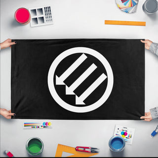 A mockup of the custom flag 'three flag' held up on a table during print checking