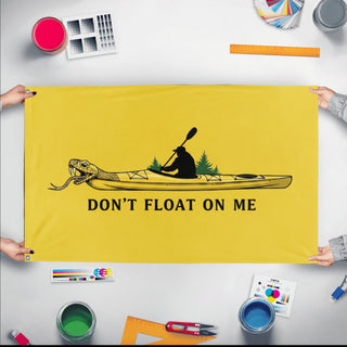 A mockup of the custom flag 'Kayak Flag 2 flag' held up on a table during print checking