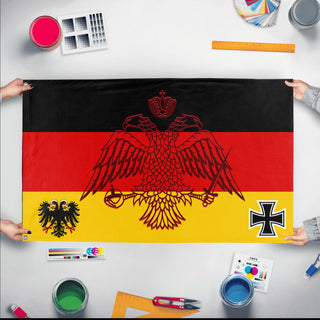 A mockup of the custom flag 'Historic Imperial German Flag' held up on a table during print checking