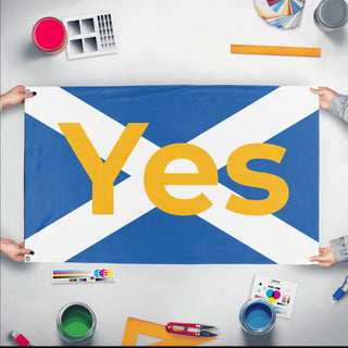 A mockup of the custom flag 'ScotlandYes flag' held up on a table during print checking