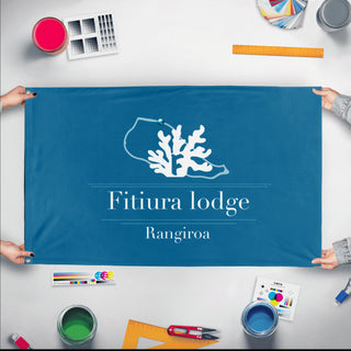 A mockup of the custom flag 'Ragni flag' held up on a table during print checking