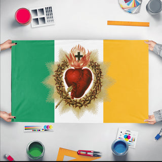 A mockup of the custom flag 'Sacred Heart flag' held up on a table during print checking