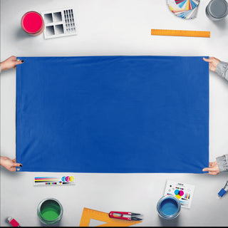 A mockup of the custom flag 'Race Officer blue Flag' held up on a table during print checking