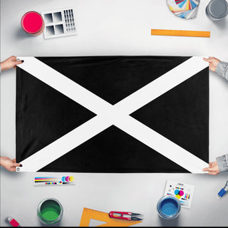 A mockup of the custom flag 'Racing Black and White Flag' held up on a table during print checking