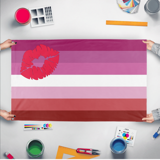 A mockup of the custom flag 'Lesbian Lipstick Flag' held up on a table during print checking