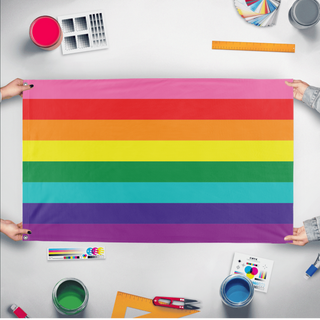 A mockup of the custom flag 'Original Flag' held up on a table during print checking