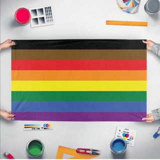 A mockup of the custom flag 'Philadelphia Pride Flag' held up on a table during print checking