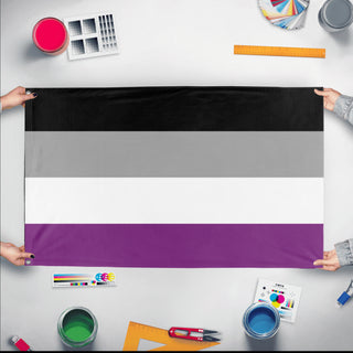 A mockup of the custom flag 'Asexual Flag' held up on a table during print checking