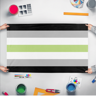 A mockup of the custom flag 'Agender Flag' held up on a table during print checking