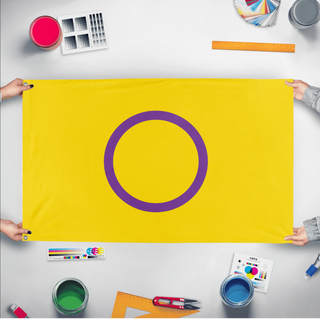 A mockup of the custom flag 'Intersex Flag' held up on a table during print checking