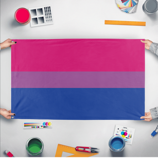 A mockup of the custom flag 'Bisexual Flag' held up on a table during print checking