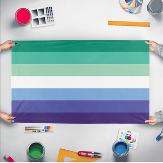 A mockup of the custom flag 'Gay Man Flag' held up on a table during print checking