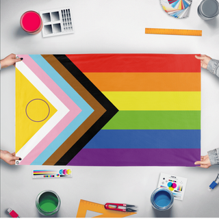 A mockup of the custom flag 'Intersex Progress Flag' held up on a table during print checking
