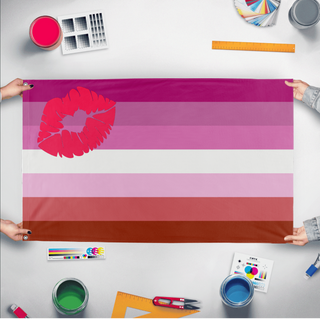 A mockup of the custom flag 'Lipstick Lesbian Flag' held up on a table during print checking