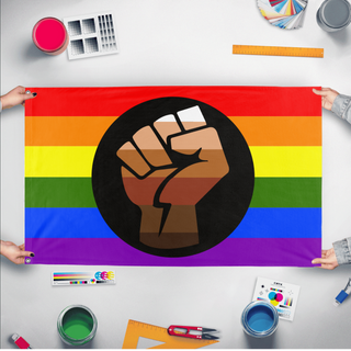 A mockup of the custom flag 'Queer People of Color Flag' held up on a table during print checking