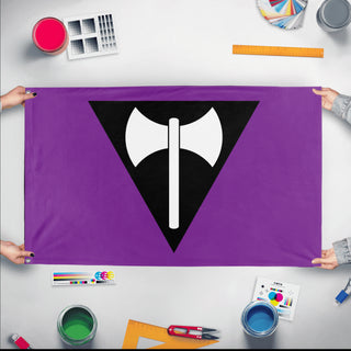 A mockup of the custom flag 'Labrys Lesbian Pride Flag' held up on a table during print checking