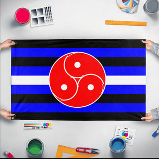 A mockup of the custom flag '& BDSM Flag' held up on a table during print checking