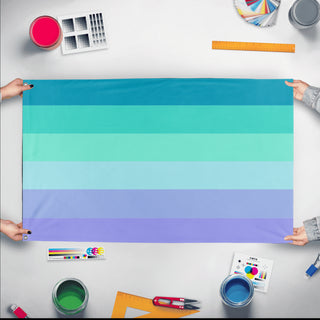 A mockup of the custom flag 'Neptunic Pride Flag' held up on a table during print checking