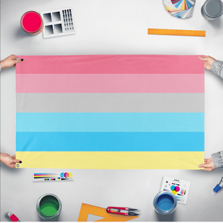 A mockup of the custom flag 'Genderflux Flag' held up on a table during print checking