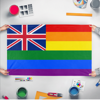 A mockup of the custom flag 'British Colonial Pride Flag' held up on a table during print checking