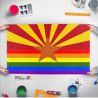 A mockup of the custom flag 'Arizona Pride Flag' held up on a table during print checking