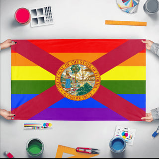 A mockup of the custom flag 'Florida Pride Flag' held up on a table during print checking
