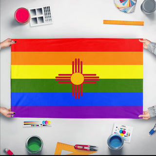 A mockup of the custom flag 'New Mexico Pride Flag' held up on a table during print checking