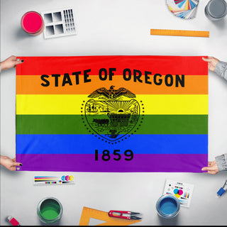 A mockup of the custom flag 'Oregon Pride Flag' held up on a table during print checking