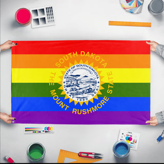 A mockup of the custom flag 'South Dakota Pride Flag' held up on a table during print checking