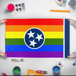 A mockup of the custom flag 'Tennessee Pride Flag' held up on a table during print checking