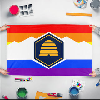 A mockup of the custom flag 'Utah Pride Flag' held up on a table during print checking