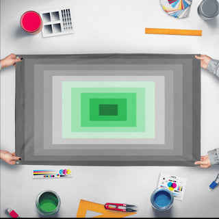 A mockup of the custom flag 'Schizophrenia Pride Flag' held up on a table during print checking