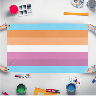 A mockup of the custom flag 'trans lesbian flag' held up on a table during print checking