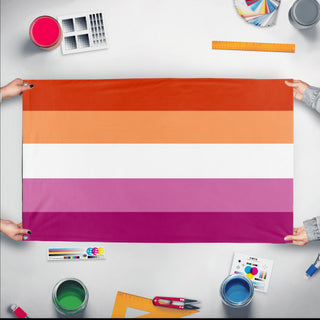 A mockup of the custom flag 'lesbian flag aesthetic flag' held up on a table during print checking