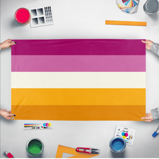 A mockup of the custom flag 'futch lesbian flag' held up on a table during print checking