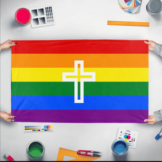 A mockup of the custom flag 'Christian Pride Flag' held up on a table during print checking