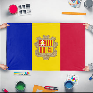 A mockup of the custom flag 'Flag of Andorra flag' held up on a table during print checking
