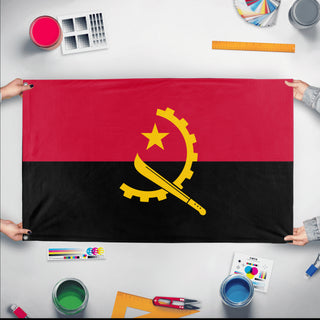 A mockup of the custom flag 'Flag of Angola flag' held up on a table during print checking