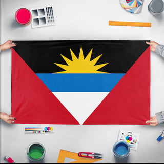 A mockup of the custom flag 'Flag of Antigua and Barbuda flag' held up on a table during print checking