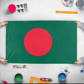 A mockup of the custom flag 'Flag of Bangladesh flag' held up on a table during print checking