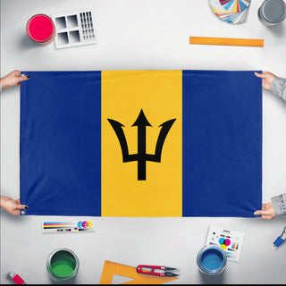 A mockup of the custom flag 'Flag of Barbados flag' held up on a table during print checking