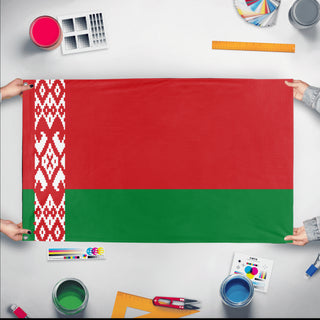 A mockup of the custom flag 'Flag of Belarus flag' held up on a table during print checking