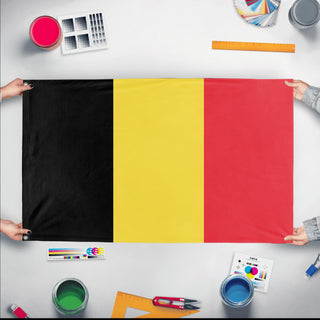 A mockup of the custom flag 'Flag of Belgium flag' held up on a table during print checking