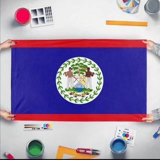 A mockup of the custom flag 'Flag of Belize flag' held up on a table during print checking