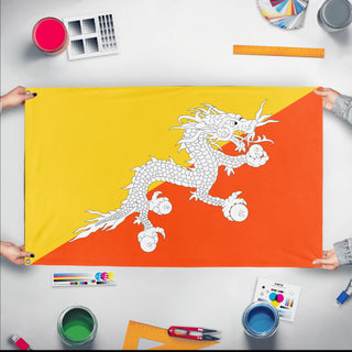 A mockup of the custom flag 'Flag of Bhutan flag' held up on a table during print checking