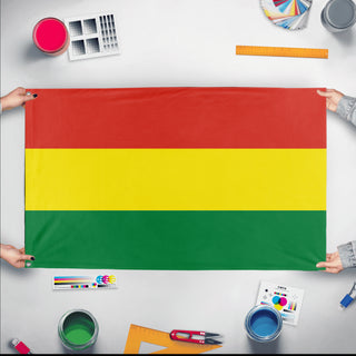 A mockup of the custom flag 'Flag of Bolivia flag' held up on a table during print checking